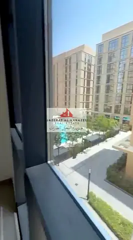 Luxury one-bedroom apartment with a living room at Al Mamsha.