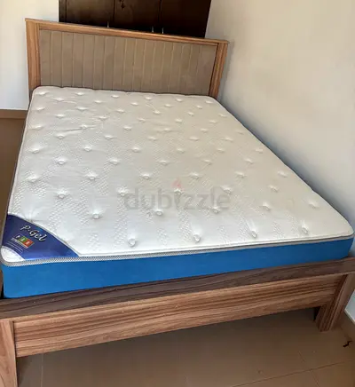 Queen-size bed frame with mattress - good condition.