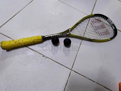 Wilson squash racket with two squash balls - used, good condition