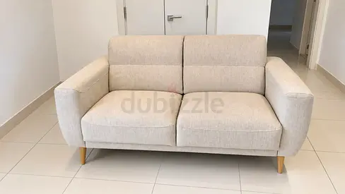 Beige 2-Seater Sofa with Wooden Legs - Good Condition