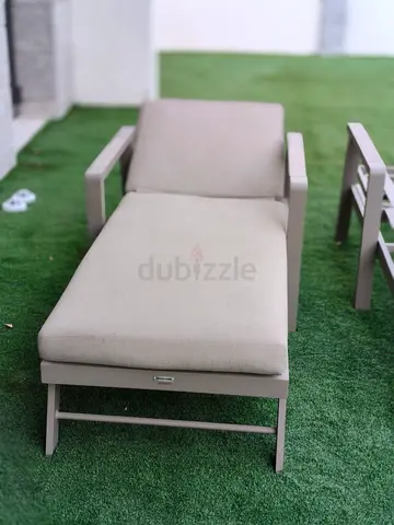 Outdoor beige lounge chaise with cushion - good condition