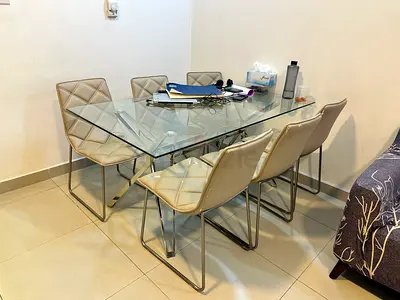 Glass Top Dining Table with 6 Beige Quilted Chairs