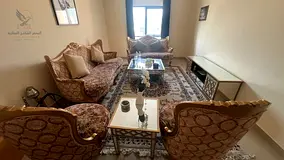 A distinctive, fully furnished 2-bedroom apartment with a living room is available for annual rent i