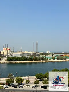 1-Bedroom Apartment for Rent in Al Majarah, Sharjah, Sea View, Spacious Living Room, Central AC & Ga