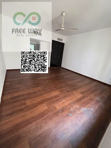 : Spacious studio available for annual rent in Al Rashidiya for only AED 18,000, payable in 4 cheques. The studio offers a practical layout, comfortab