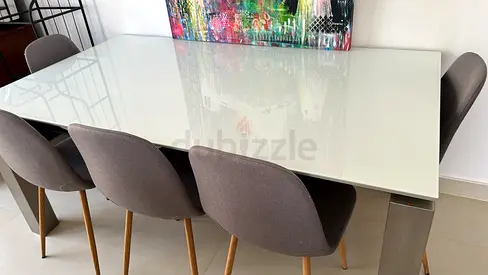 Modern glass-top dining table with 6 upholstered chairs (Jysk)