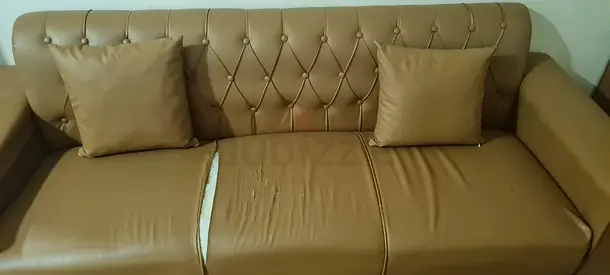Used 3-seater brown faux leather sofa with minor tear - good condition