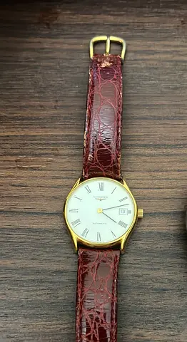 Vintage Longines men's gold-tone wristwatch with brown leather strap
