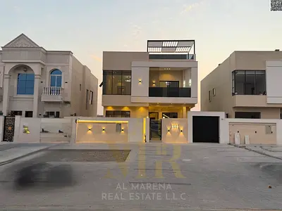 Luxury villa for sale in Al Zahia, Ajman. 5 master bedrooms, majlis, living room, and maid's room. Includes registration and ownership fees. Freehold.