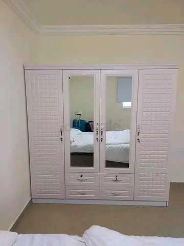 4door wardrobe brand new with mirror