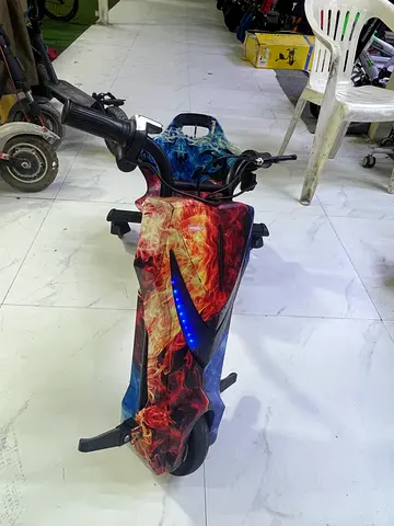 Electric Scooter with Flame Graphics - Good Condition