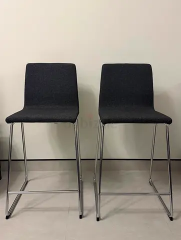 IKEA dark grey fabric bar stools with chrome legs