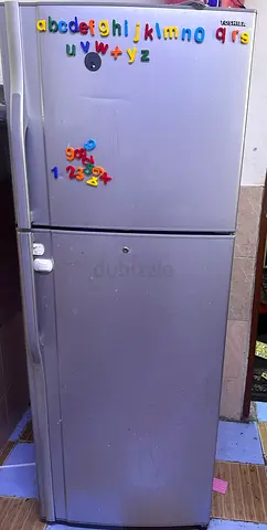 Silver double-door refrigerator with freezer - used, working
