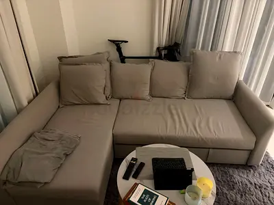 Light grey L-shaped sofa with chaise - good condition