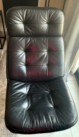 Black leather lounge chair — single modern seat, good condition