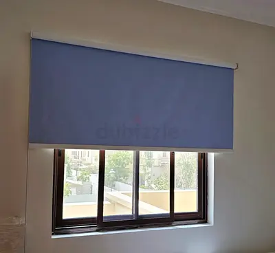 Roller blackout light blue and grey (W 200 H 190) used only 1 year. Original price 500aed.