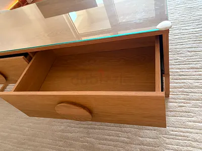 Solid wood coffee table with glass top and storage drawers