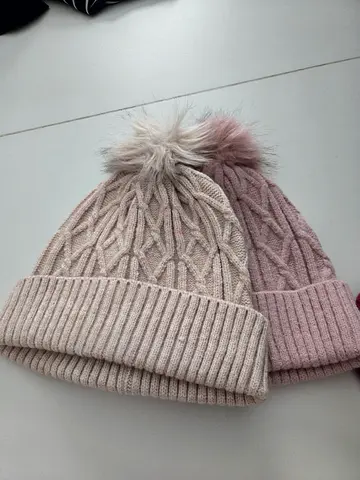 Two knitted winter pom-pom beanies - beige and dusty pink