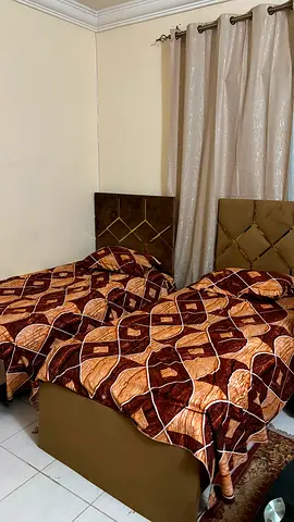 Two single beds with headboards and mattresses - good condition