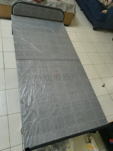 Foldable bed with folding medicated mattress