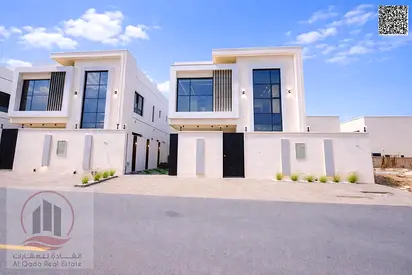 Villa for sale in Al Zahia, Ajman: 5 master bedrooms, majlis, living room & pool. Freehold, bank finance. Registration, transfer, water & electricity