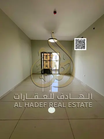 For those seeking a premium annual rental in Ajman: A 2-bedroom apartment with a separate living room and 3 bathrooms, featuring built-in wardrobes. This is a "second-occupant" unit (previously occupi