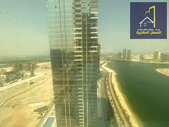 bedrooms and a hall in the most luxurious towers of Al Mamzar and Sharjah with a direct view of Al M
