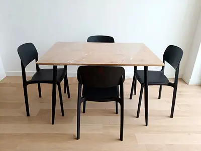 Modern wooden dining table with 4 black chairs - good condition