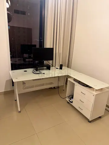 White tempered glass-top office desk with mobile drawer unit