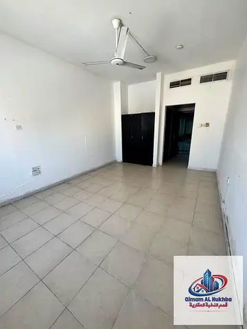 Huge studio with sea view in Al Mujarrah! Separate kitchen, built-in wardrobes, near Corniche & Dubai exit. Free maintenance, easy payments.