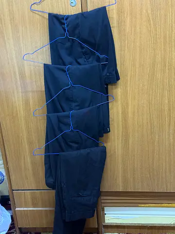 Lot of 4 black men's formal trousers - size unknown, good condition 80 aed for all 4