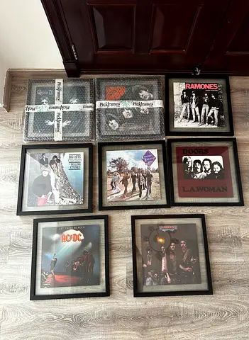 8 framed Vinyls and two metal wall photos