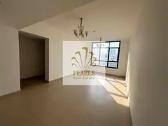 A two-bedroom apartment with a living room is available for annual rent in Al Nuaimiya, Ajman, near
