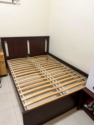 Queen wooden bed frame with slatted base — dark brown, good condition