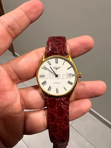 Vintage Longines men's gold-tone wristwatch with brown leather strap