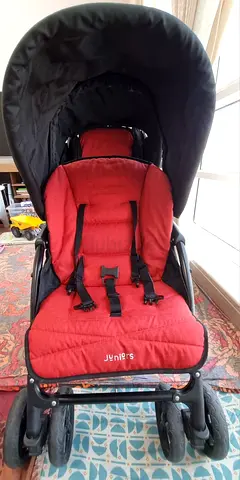 Red Jouniers baby stroller in good condition