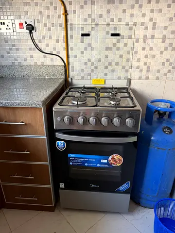 Used 4-Burner Gas Stove with Oven - Good Working Condition
