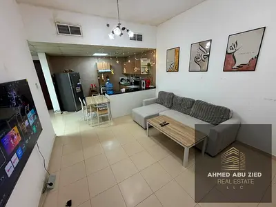 Reselling a one-bedroom apartment with a living room in City Tower. The apartment is 865 sq ft with a down payment of 180,000 AED.