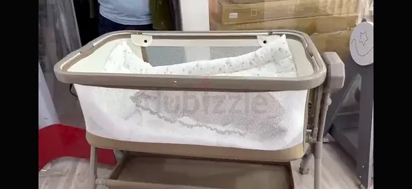 Portable bassinet / cradle with storage shelf — gently used