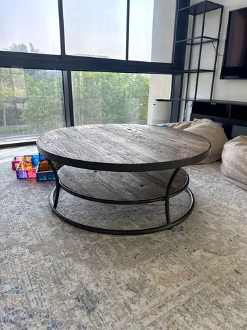 Round wooden coffee table with metal frame - good condition. From Pottery Barn USA