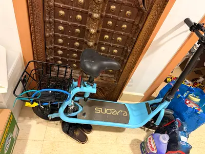 EVEONS Light blue adult electric scooter with rear basket and seat - used