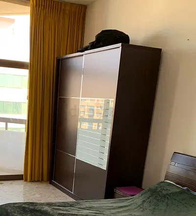Dark wood sliding door wardrobe - good condition