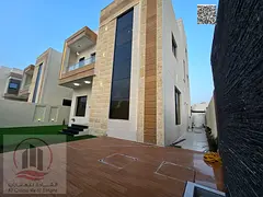 Villa for sale in Al Helio, Ajman—registration fees included. Features 5 master bedrooms, a roofto