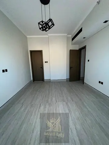 Two-bedroom apartment with a living room for annual rent in Al Falaj, Sharjah.