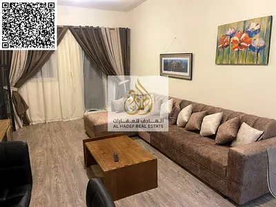 One-bedroom apartment with a living room at Ajman One Tower 5; features a closed kitchen, two bathrooms, and a balcony. Superbly furnished and availab