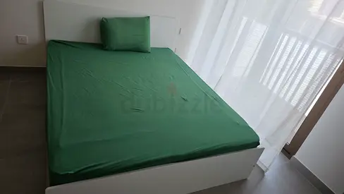 White platform bed frame with headboard and mattress very good condition