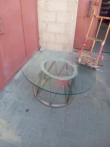 Round glass coffee table with metal base - good condition