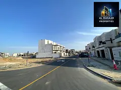 Residential plot for sale in a prime location in Al Helio 2, Ajman; price includes double registrati