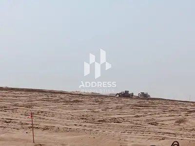 For Sale: Residential and Commercial Plot in Sharjah – Al Ruwaidat, featuring a prime location ideal for real estate investment.