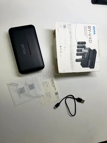 the BOYA BY-V4D 4-Channel Mini Wireless Microphone System